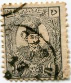 نقش ناصرالدین شاه در وسط تصویر و سر شیر در پایین